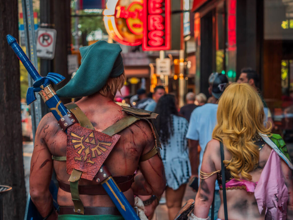 Two cosplayers walking along Peachtree Street during Dragon Con