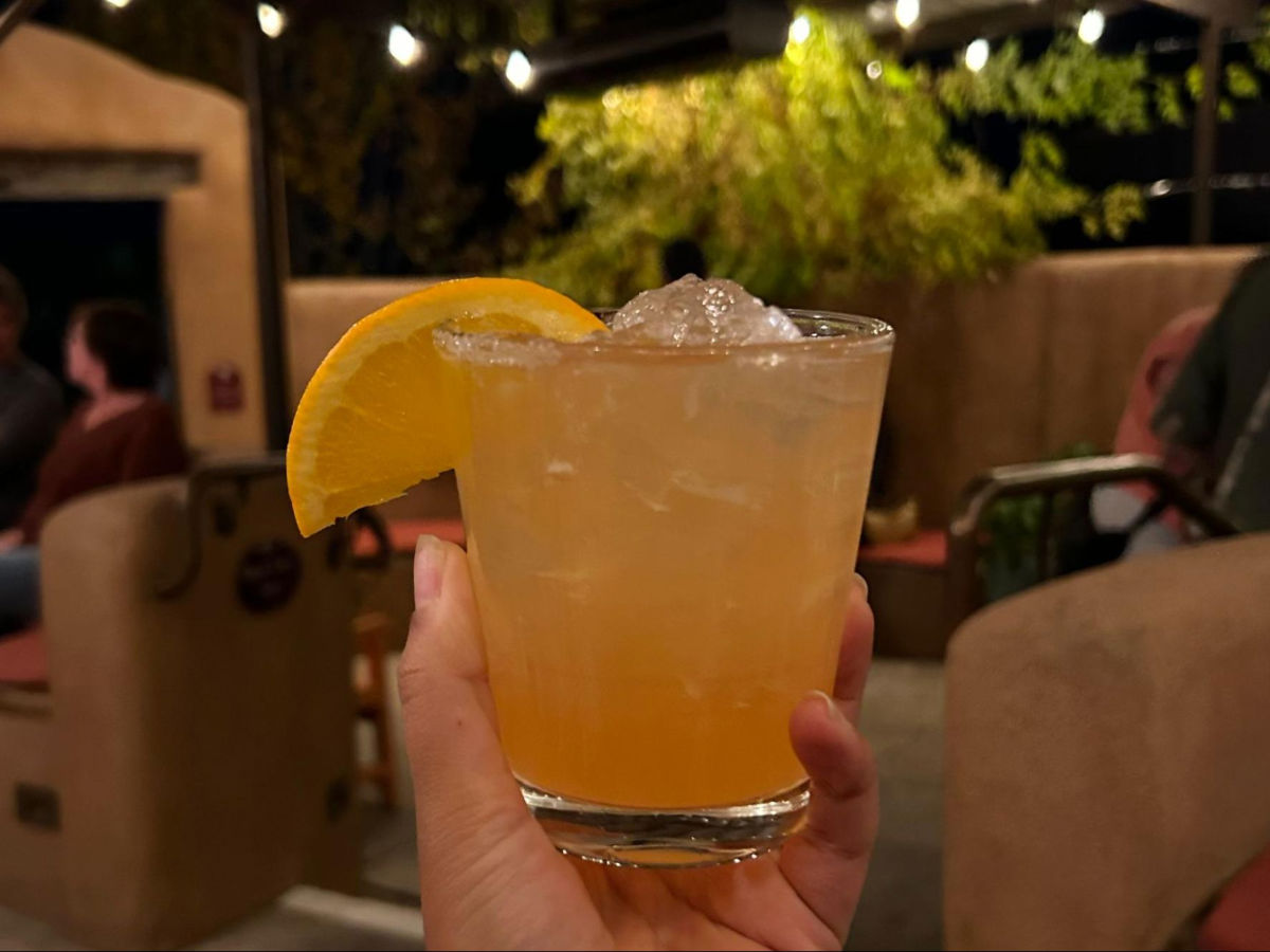 Holding a glass of Margarita at La Choza