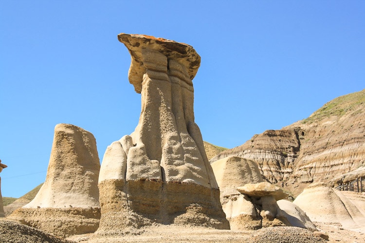 Carved sandstone hoodoos stand tall in Drumheller