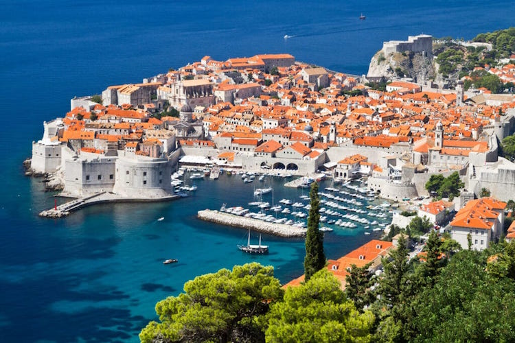 An aerial shot of downtown Dubrovnik, surrounded by the Adriatic Sea