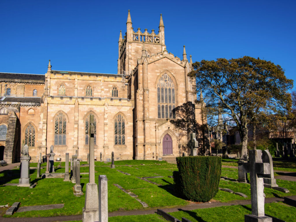 Side view of Dunfermline abbey with a memorial to Robert the Bruce on the tower