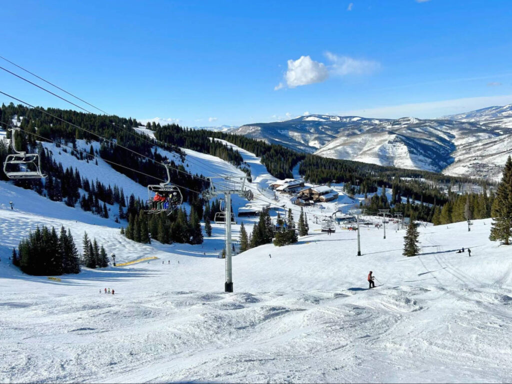 Scenic view of the snow covered mountains and the ski lifts