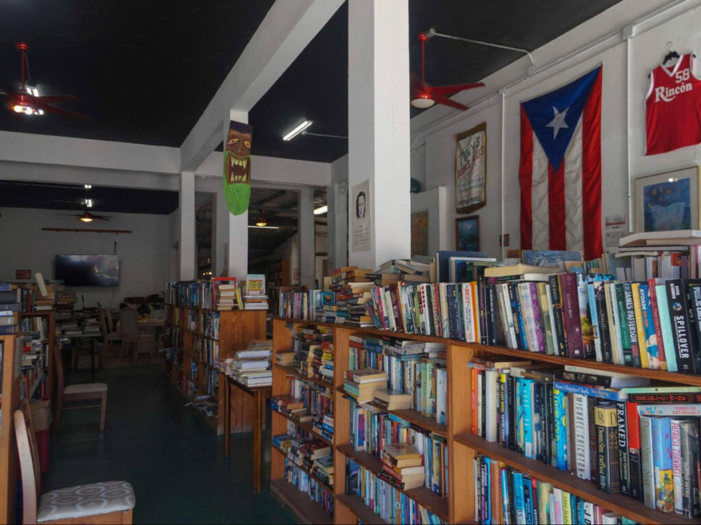 View of the shelves full of books displayed inside El Coquí Bookstore