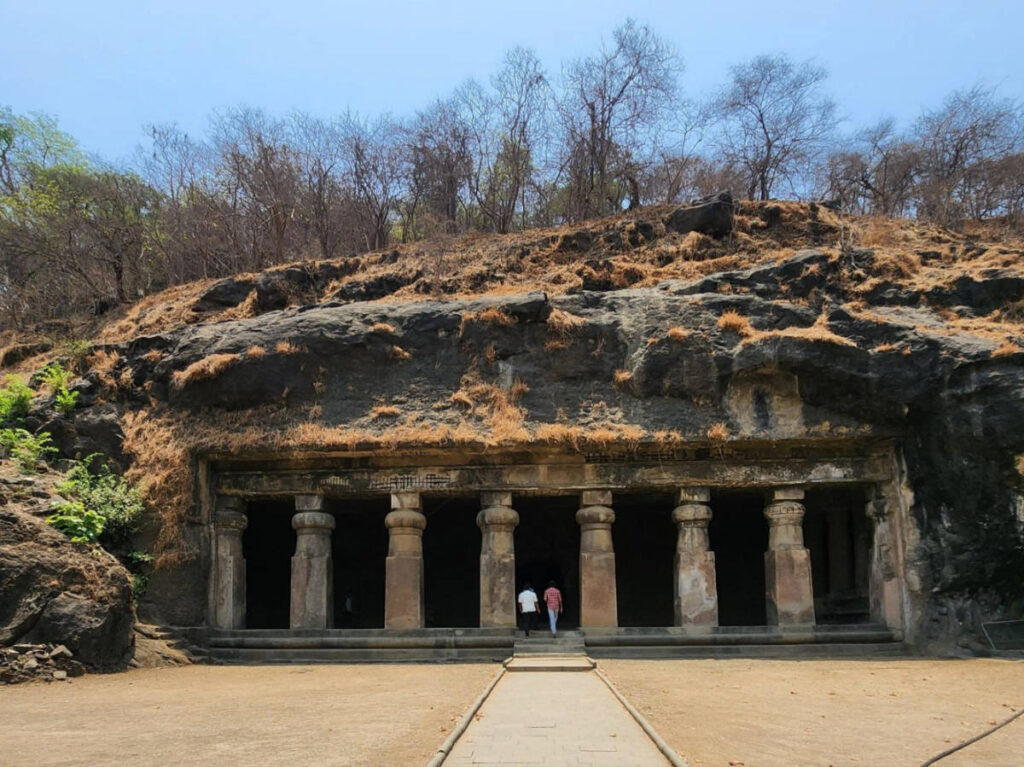 People entering the ancient rock-cut caves at Elephanta