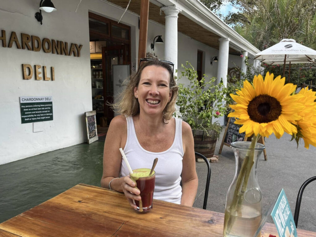 The author Elise Kirsten, enjoying a healthy drink at the Chardonnay Deli