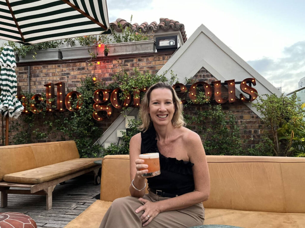 The author Elise Kirsten, enjoying her whiskey sour at Gigi's Rooftop Restaurant and Bar