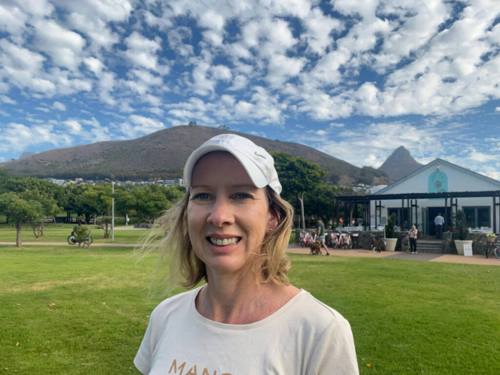 The author Elise Kirsten, smiling for a photo at Greenpoint Park