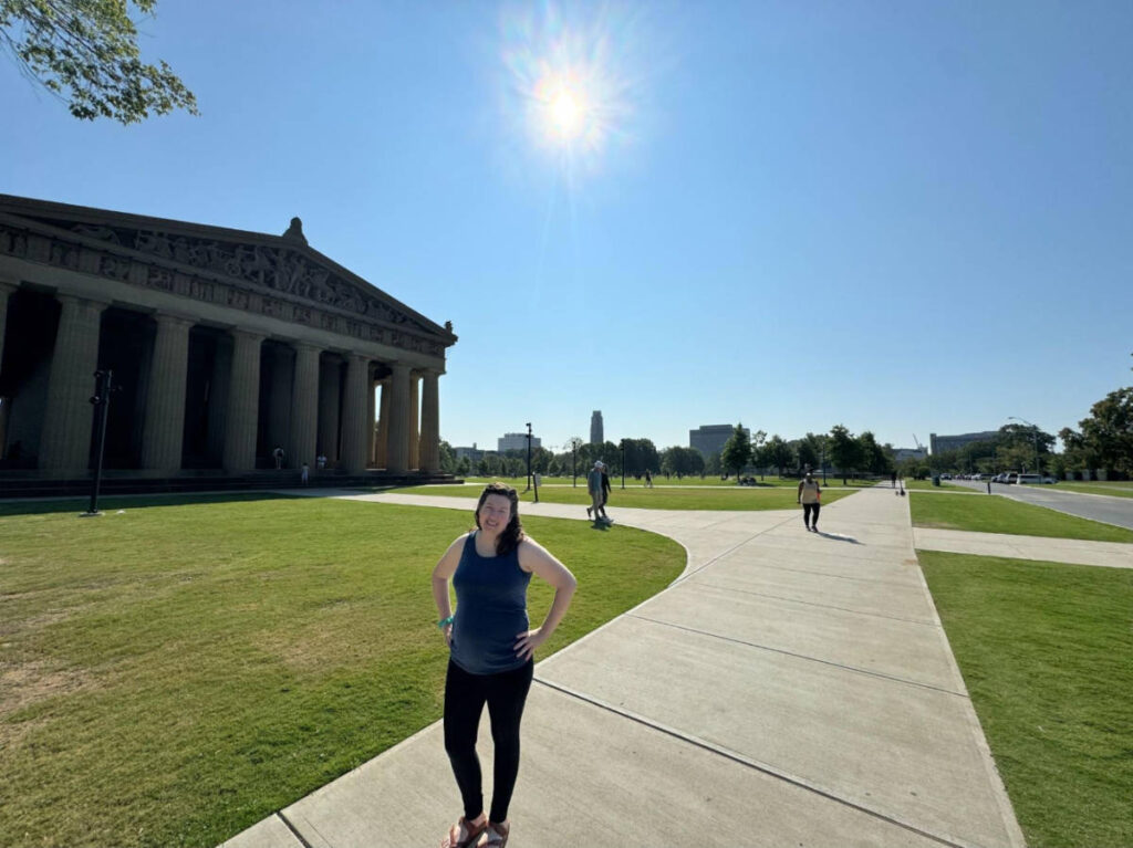 The author Elizabeth Demolat posing for a photo at the Centennial Park