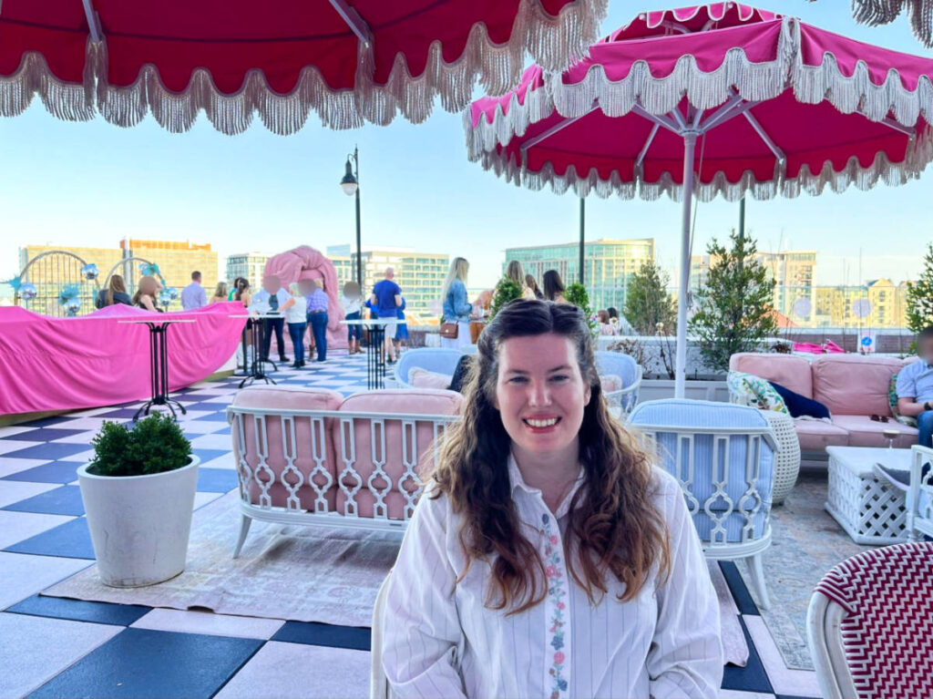 The author Elizabeth Demolat, sitting at the rooftop patio of White Limozeen