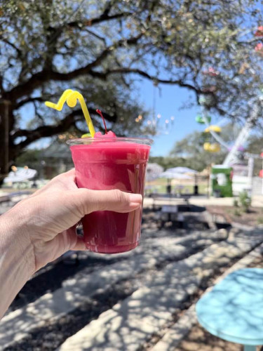 Holding an adult slushie at Elsewhere Too