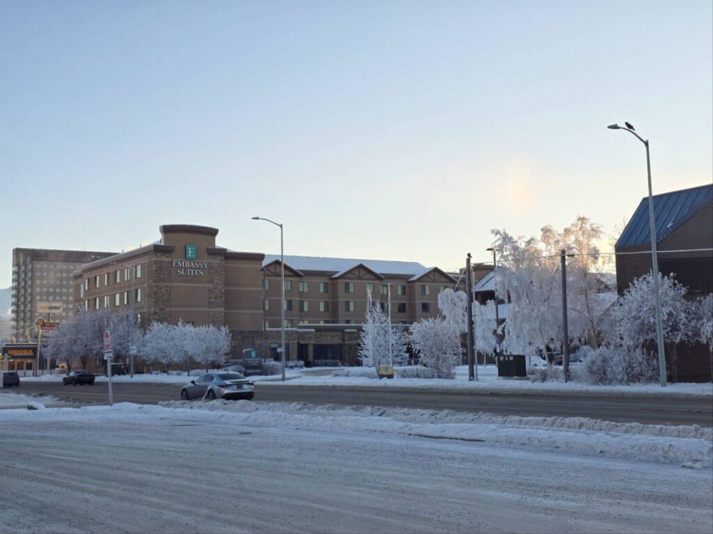 The Embassy Suites Anchorage and the snow covered rad in Anchorage