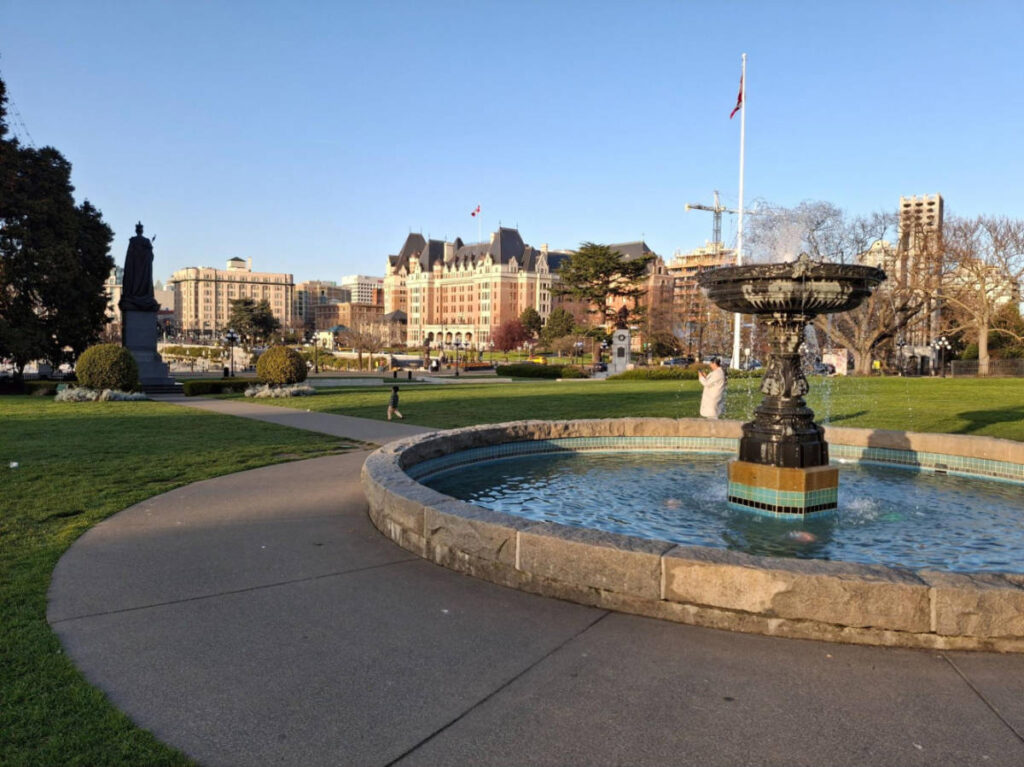 View of the Empress Hotel from the fountain area and lawn of the Parliament Buildings