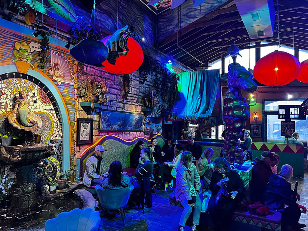 A crowd gathered at the bar and lounge of Esther’s Follies