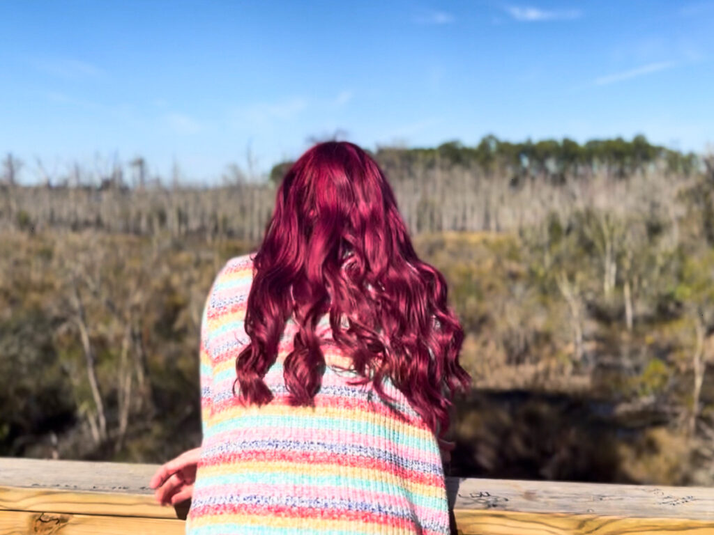 The author Ethan Thoren's partner, Olivia, enjoying the view at Tillie K. Fowler Regional Park