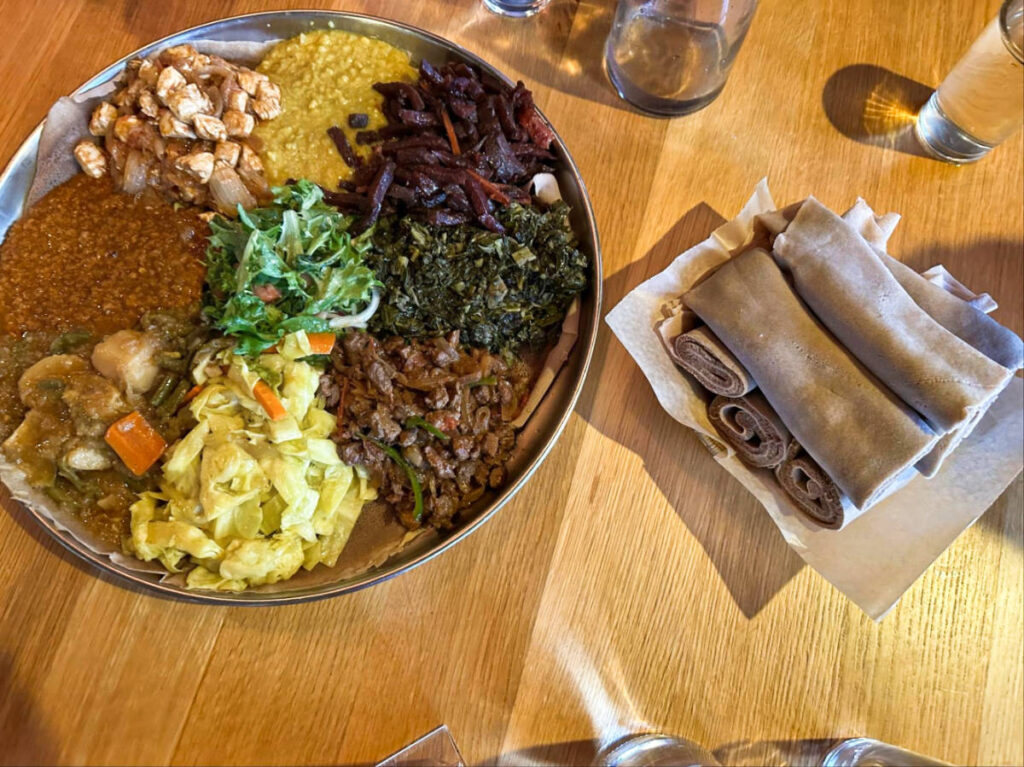 A Ethiopian messob platter with meats and vegetables from Demera Restaurant