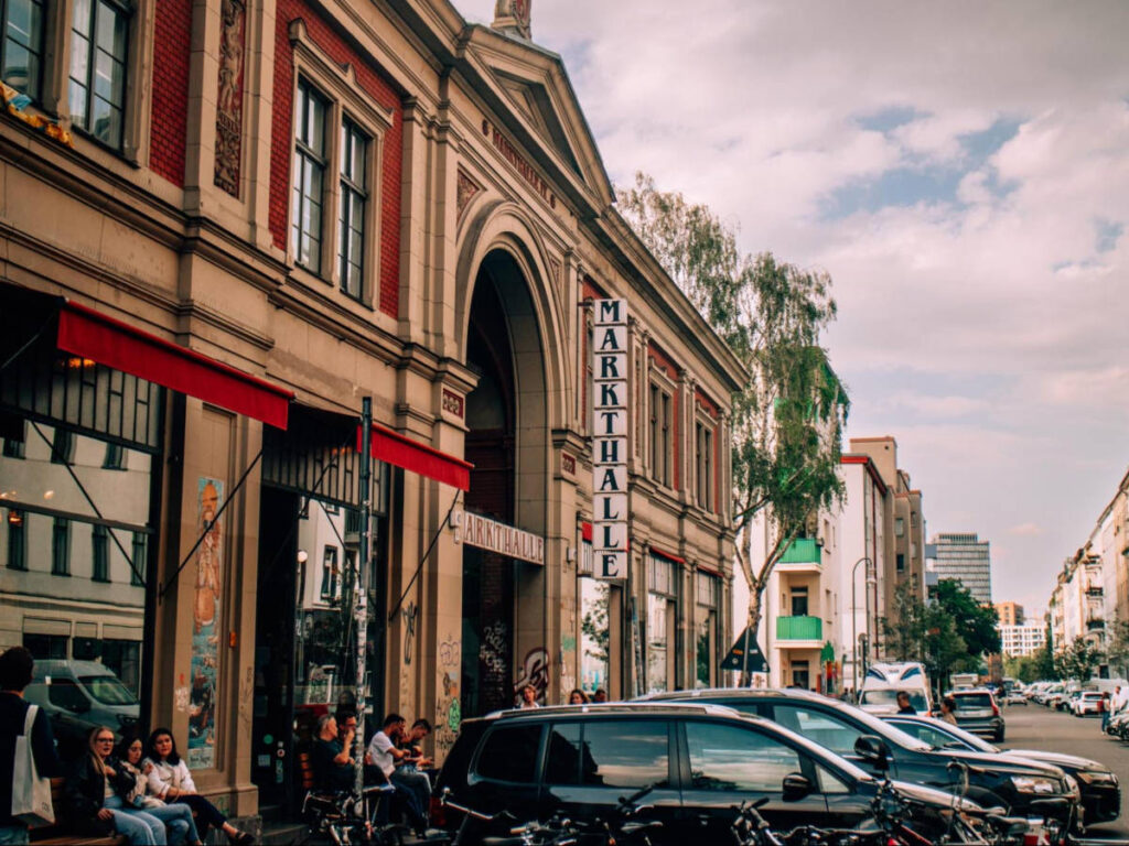 People seating outside the Markthalle Neun