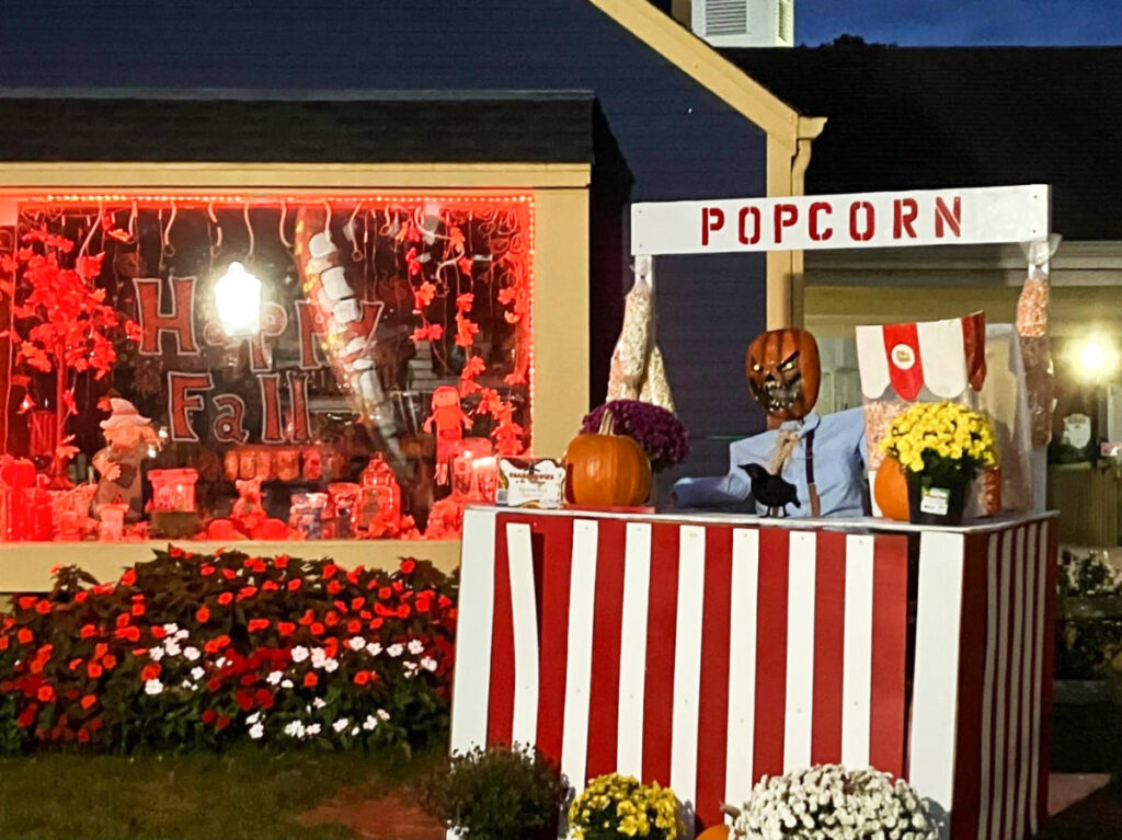 A popcorn stall with fall and Halloween decorations at the Old Mistick Village