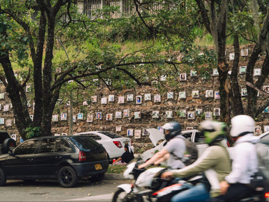Panoramic view of the false-positives memorial wall seen from across the street in Medellín