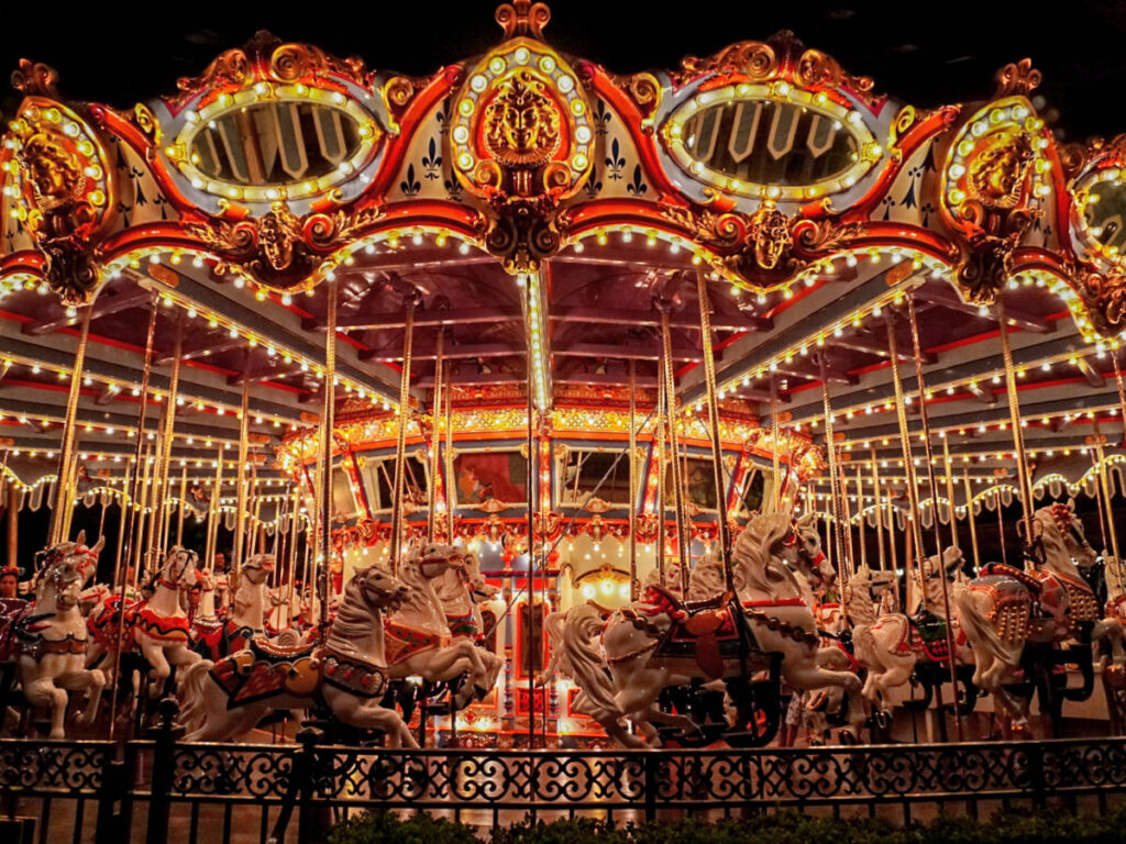 The Fantasyland Merry-Go-Round illuminating at night