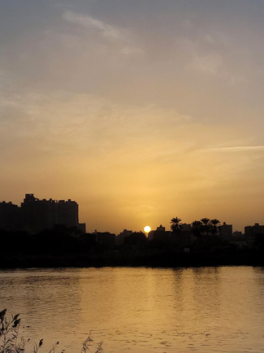 View while riding on a felucca boat on the Nile River during sunset