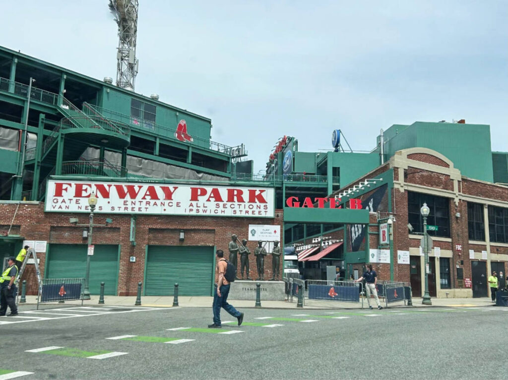 People passing by the Fenway Park Stadium in Boston