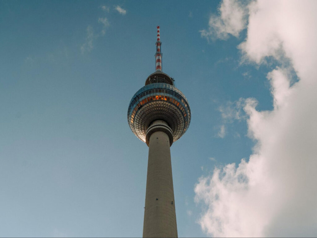 Perspective view of the tower of Fernsehturm against the blue sky