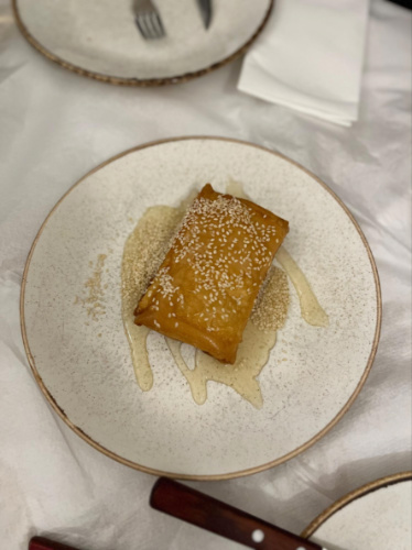 A plate with feta in phyllo dough drizzled with honey
