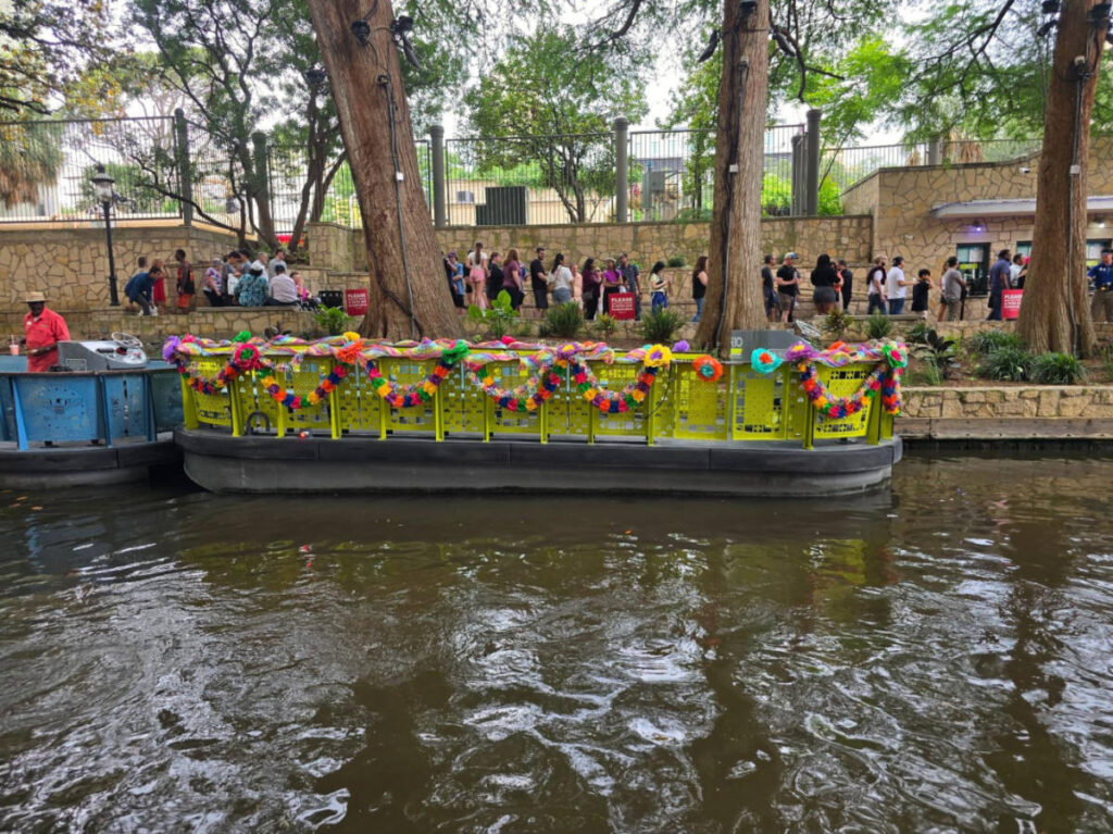 View of the river barges decorated with bright flowers during the Fiesta San Antonio