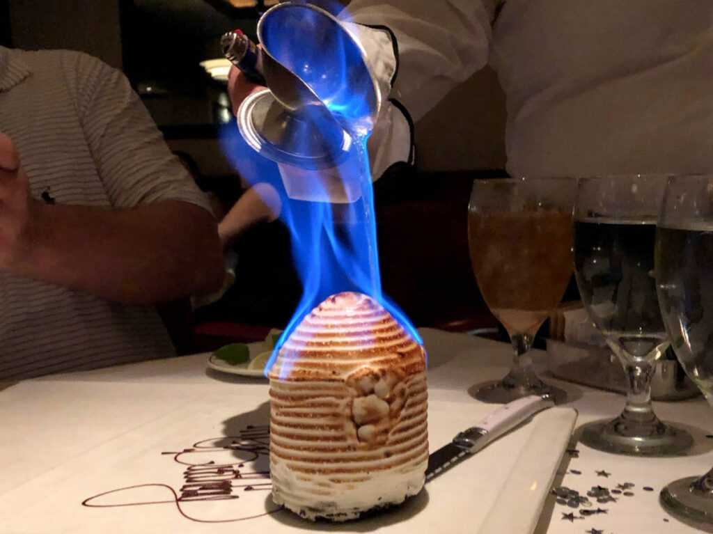 Closeup look of the flaming meringue cake dessert at Trulucks
