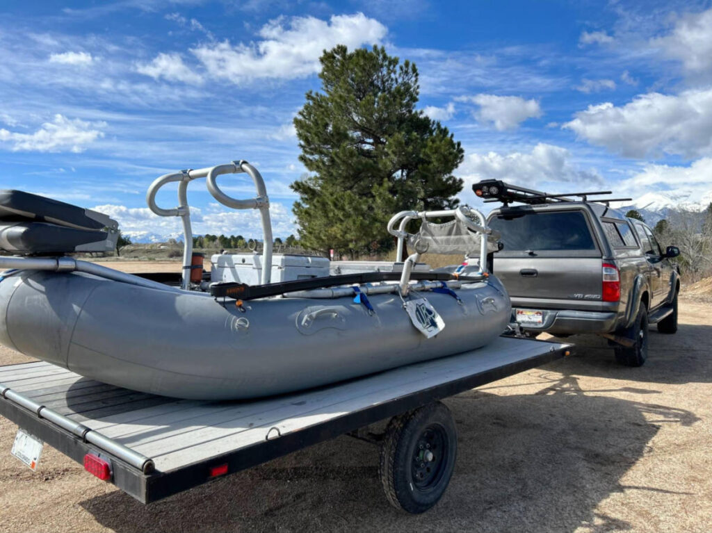 A fly fishing float towed behind the car