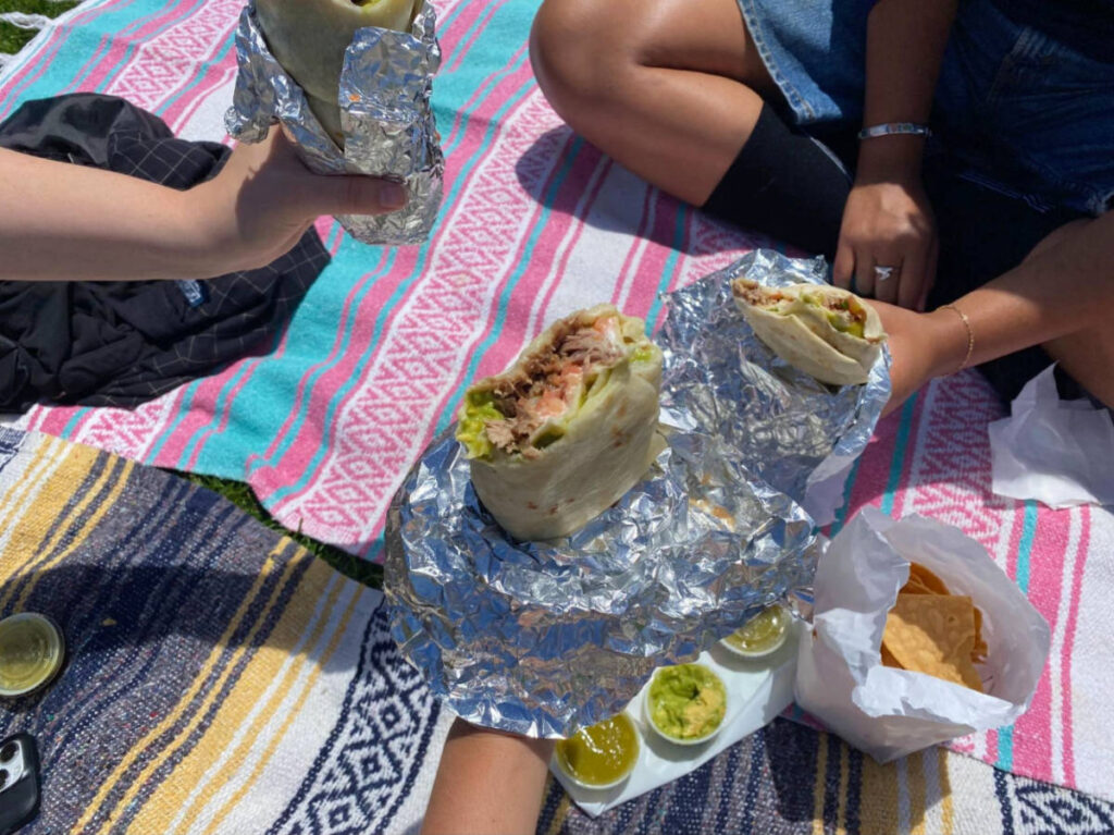 Laura and her friends eating La Taqueria in Dolores Park