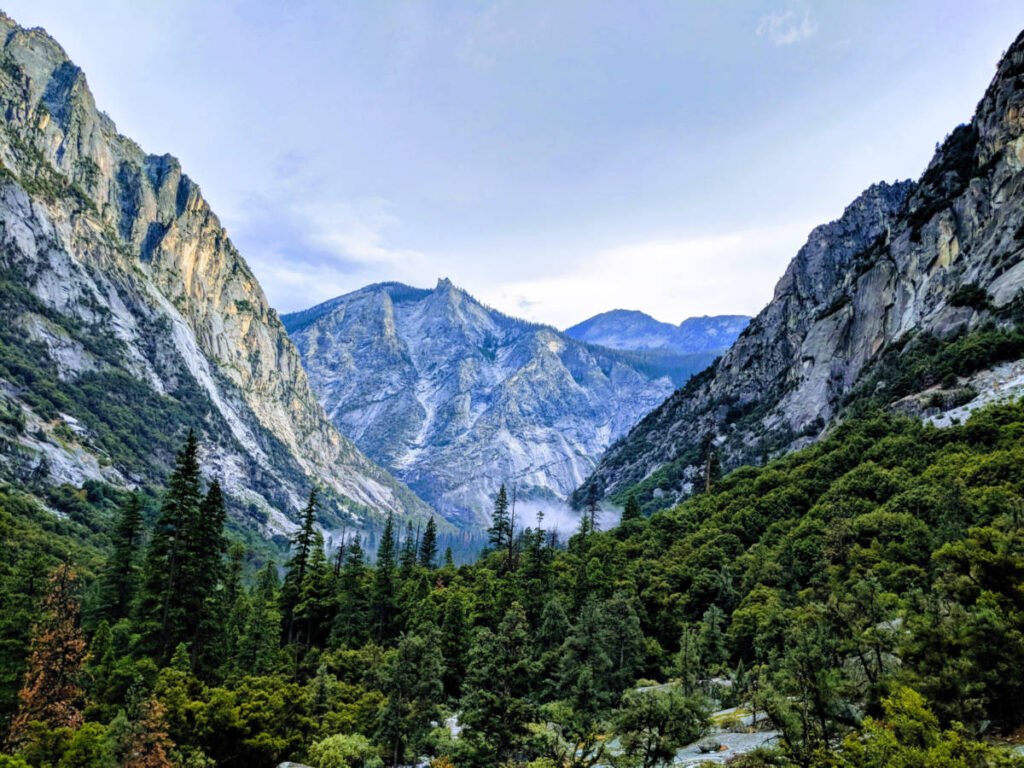 View of the lush forest below the granite crags at Sequoia National Park