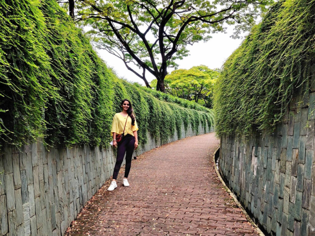 The author, Advaita smiling for a photo in Fort Canning Park