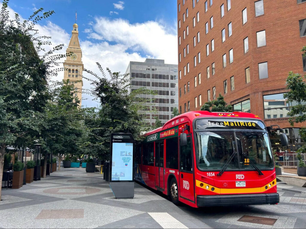 A red bus in the streets in Denver
