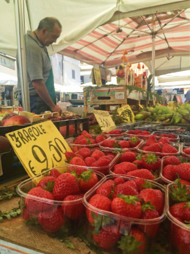 Fresh strawberries displayed on a market