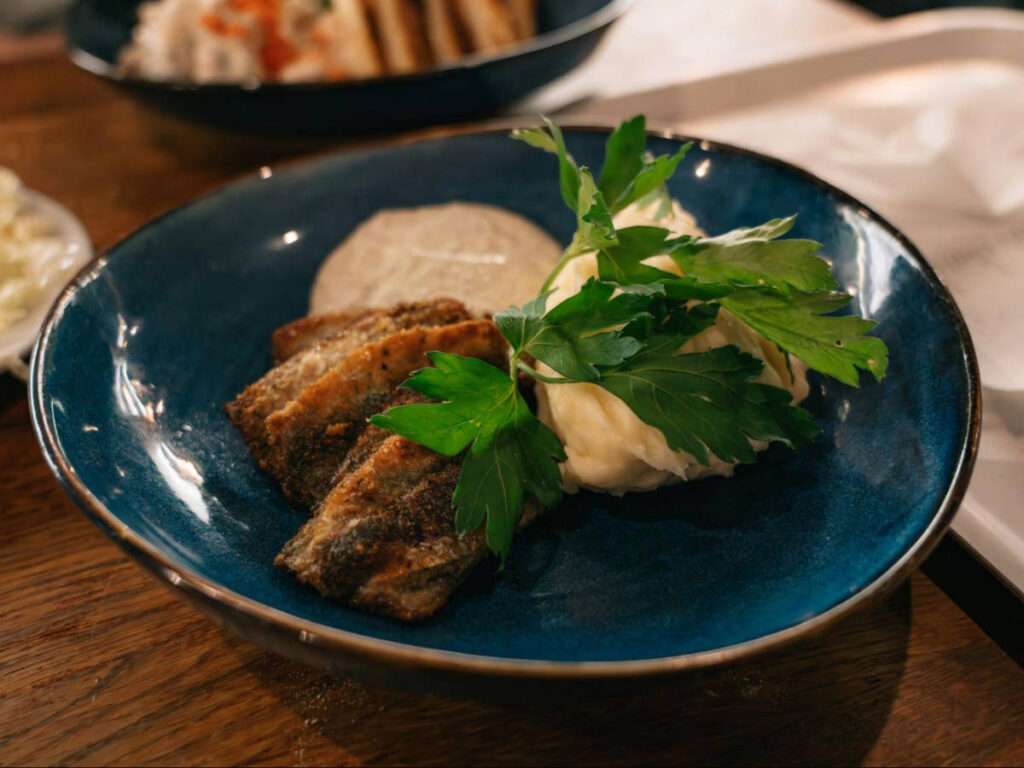 A plate with fried herring at Restaurant Kajsas Fisk