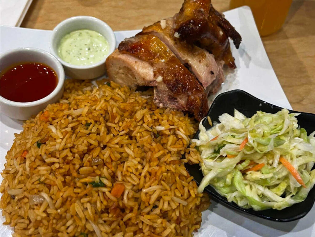 A plate with fried rice and rotisserie chicken combo at Cantoo