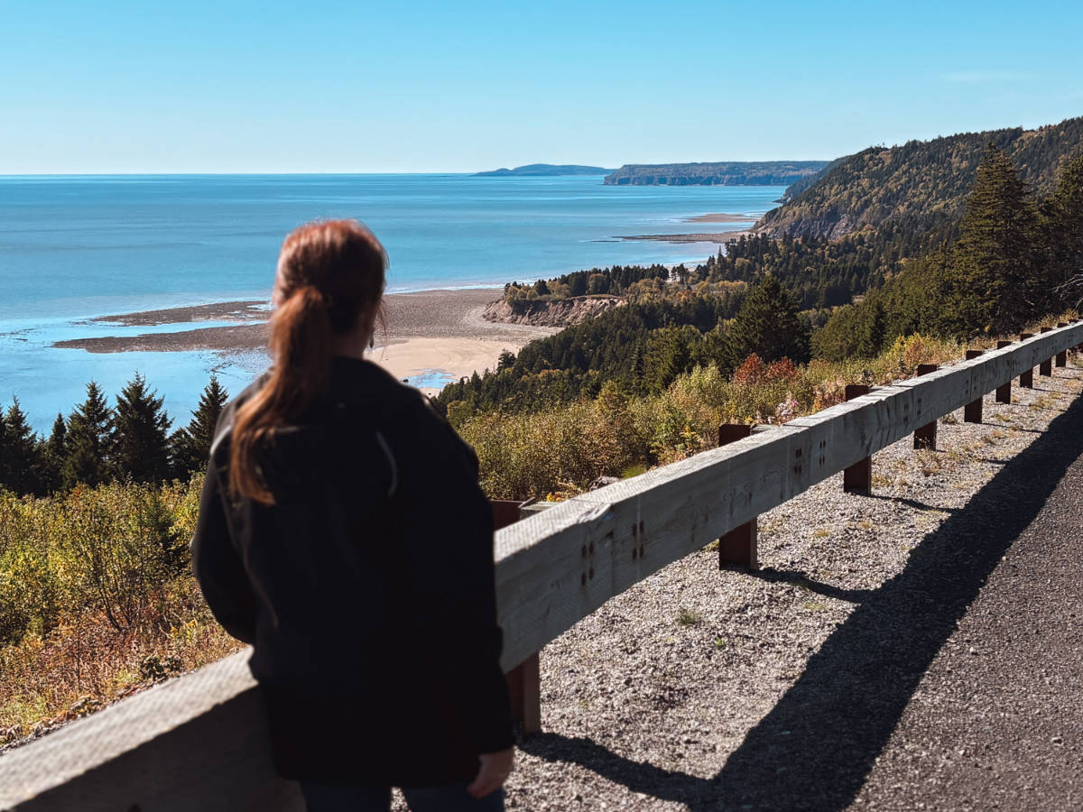 The author's mom admiring the view in Fundy Coastal Drive in New Brunswick