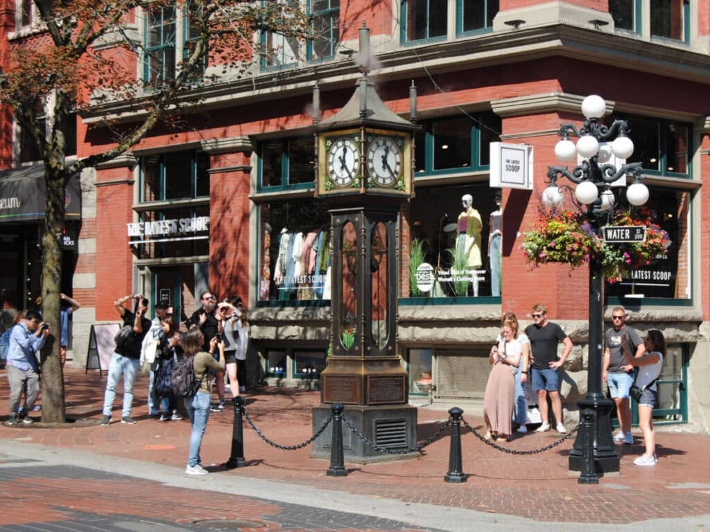 People taking photo of the steam clock in Gastown