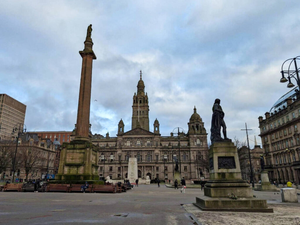 A statue and the City Chambers at the George Square