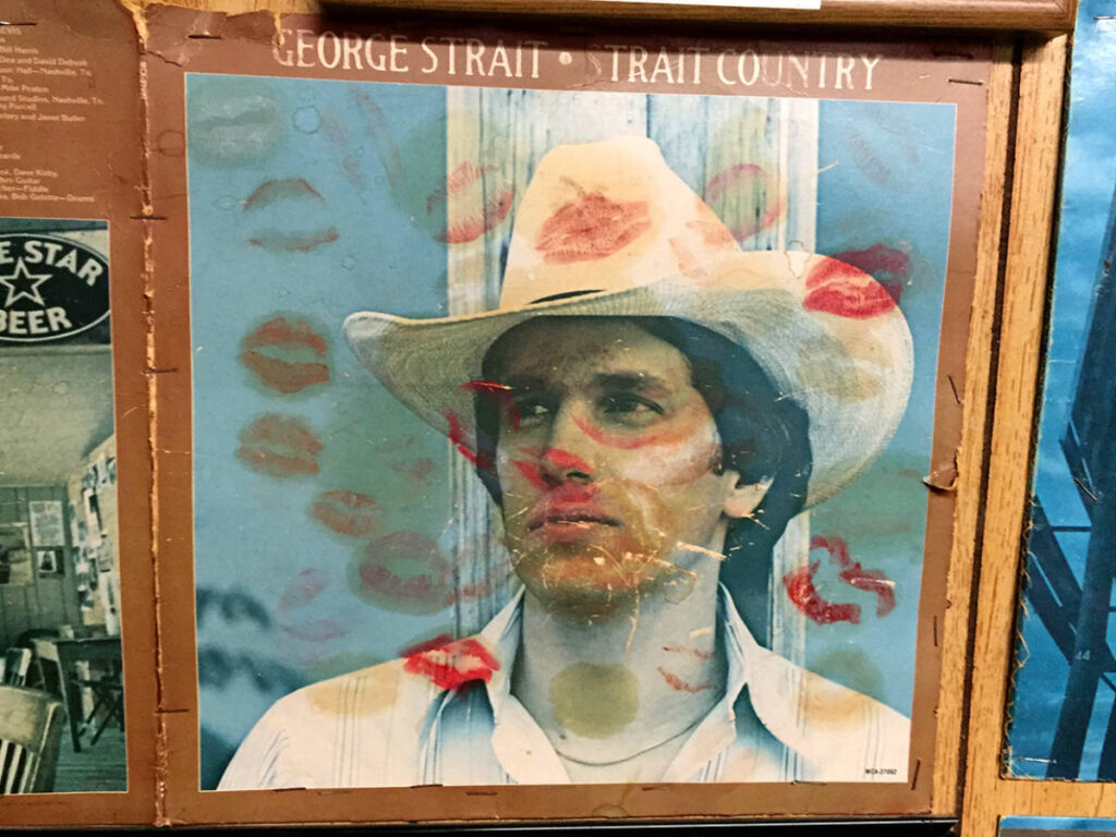 Lipstick kisses adorn George Strait’s album cover