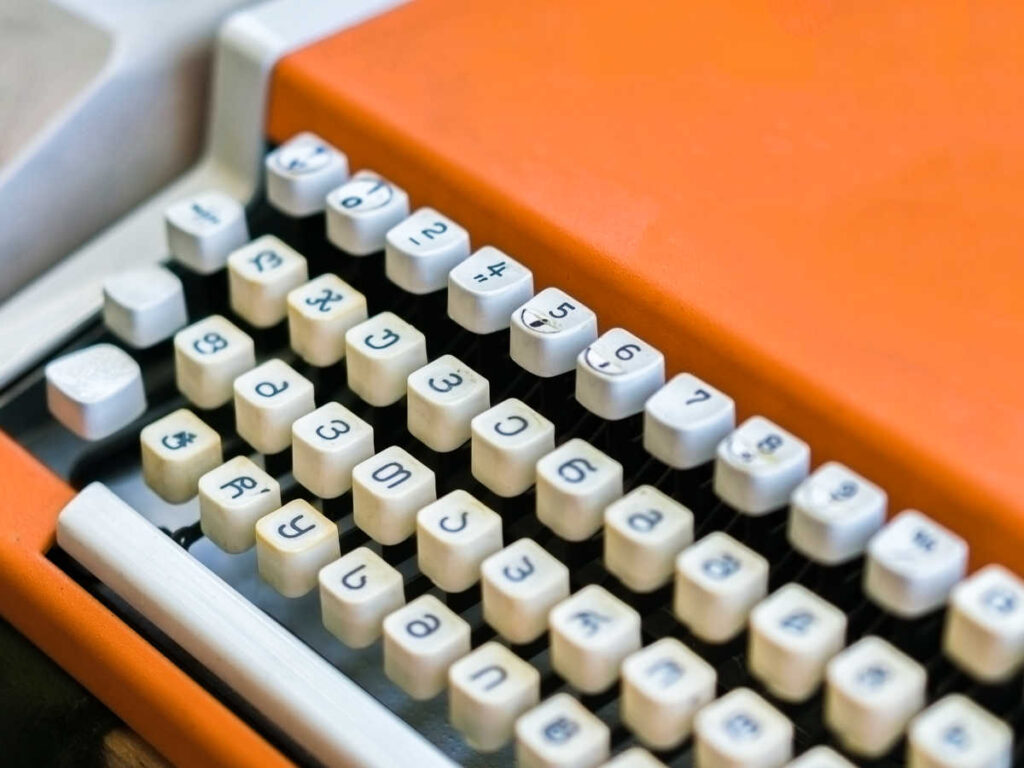 Closeup look of the Georgian alphabets on a orange typewriter