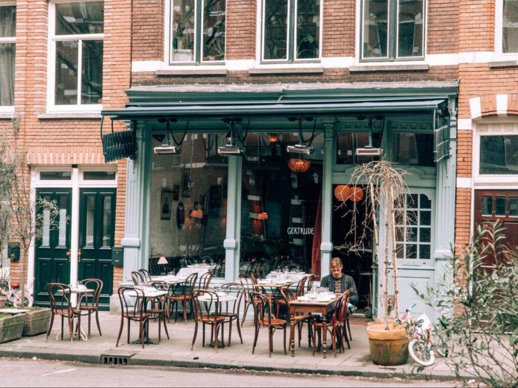 A man dining outside the  Gertrude restaurant