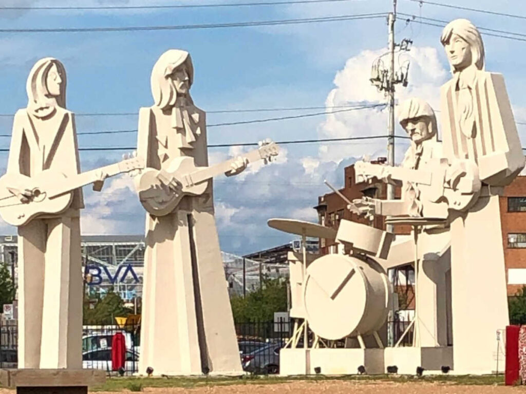 The giant Beatles statues at 8th Wonder Brewery
