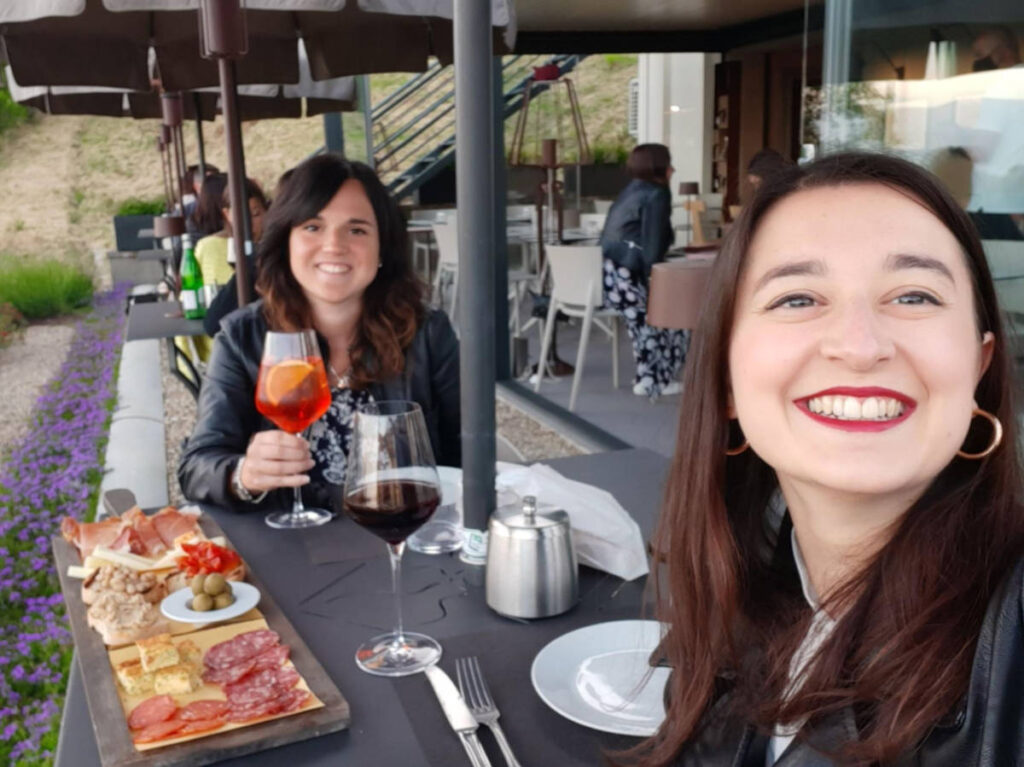 The author Giorgia Giustolisi and her friend, enjoying Tuscan Aperitivo and a cheese board