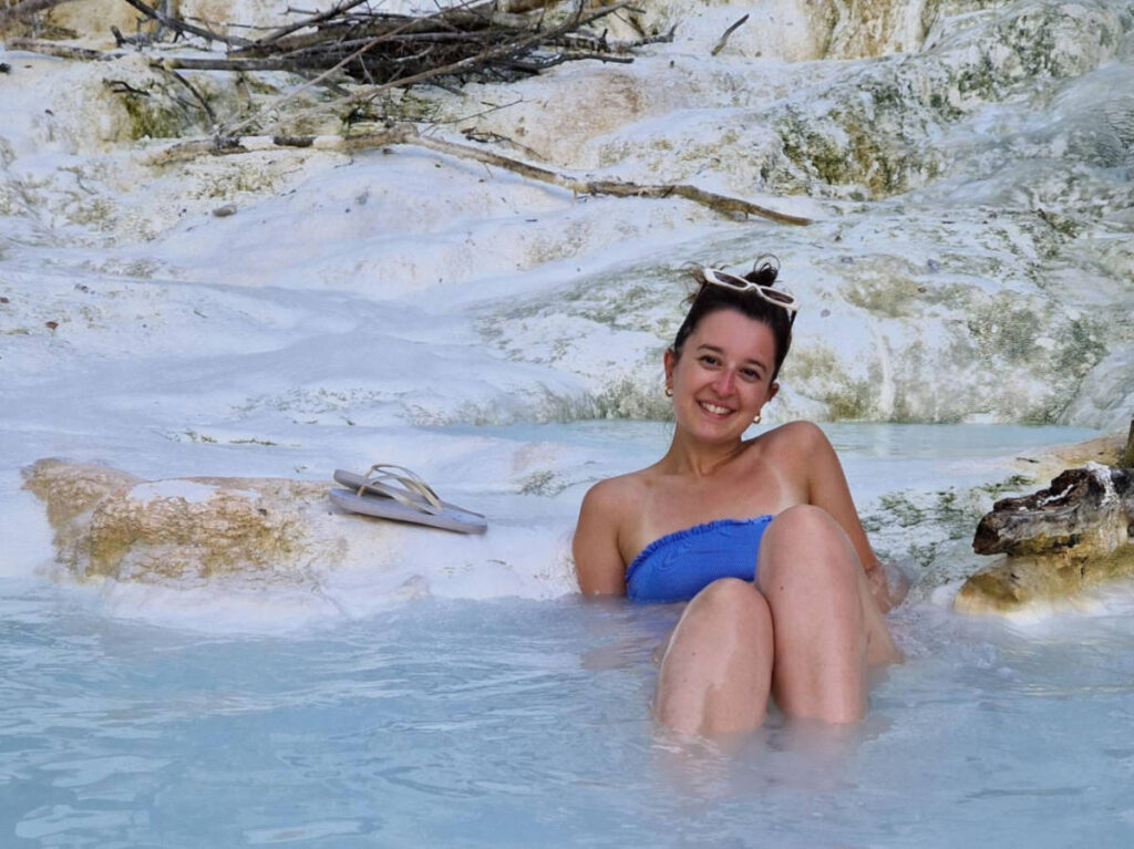 The author Giorgia Giustolisi, soaking in the hot springs at Bagni di San Filippo
