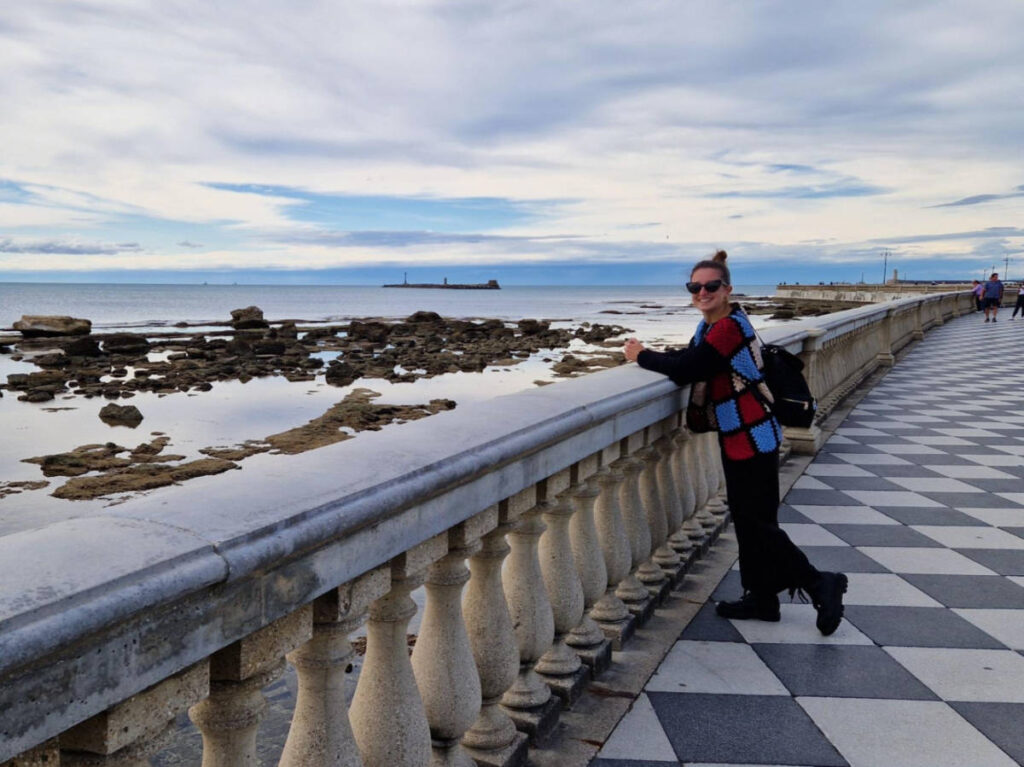 The author Giorgia Giustolisi, posing for a photo at the Terrazza Mascagni with seafront views