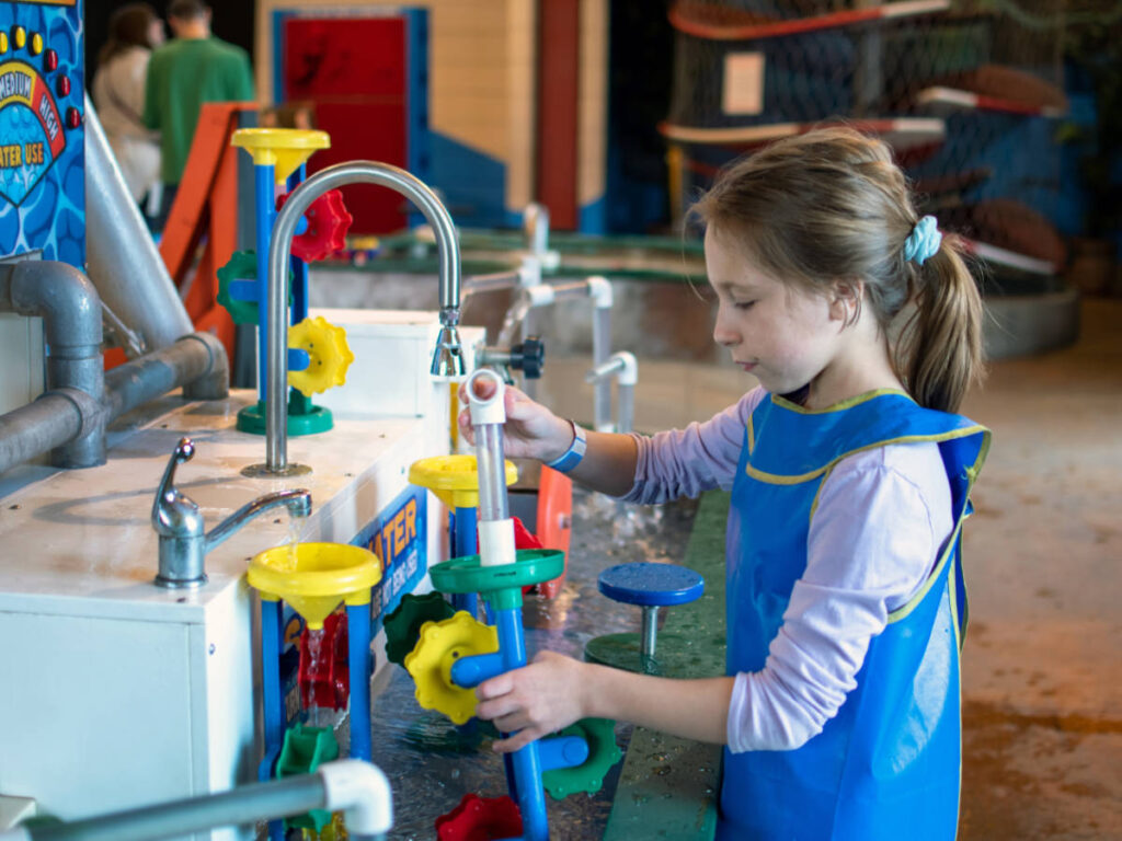 A girl enjoying her day at the Boonshoft Museum of Discovery