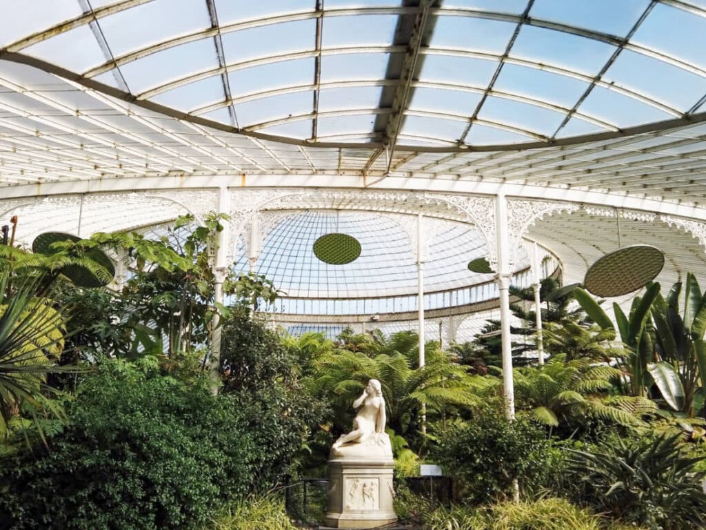 Plants and statue inside the Glasgow Botanic Gardens
