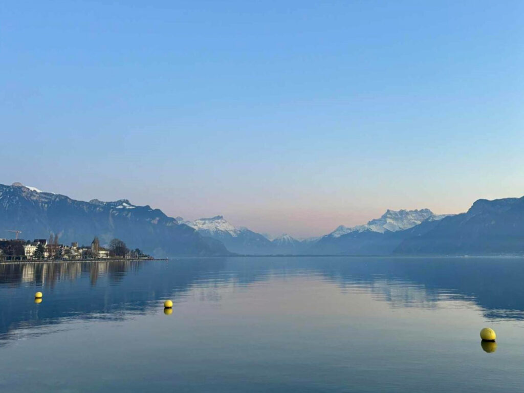 Scenic view of the glass-like Lake Geneva at sunset